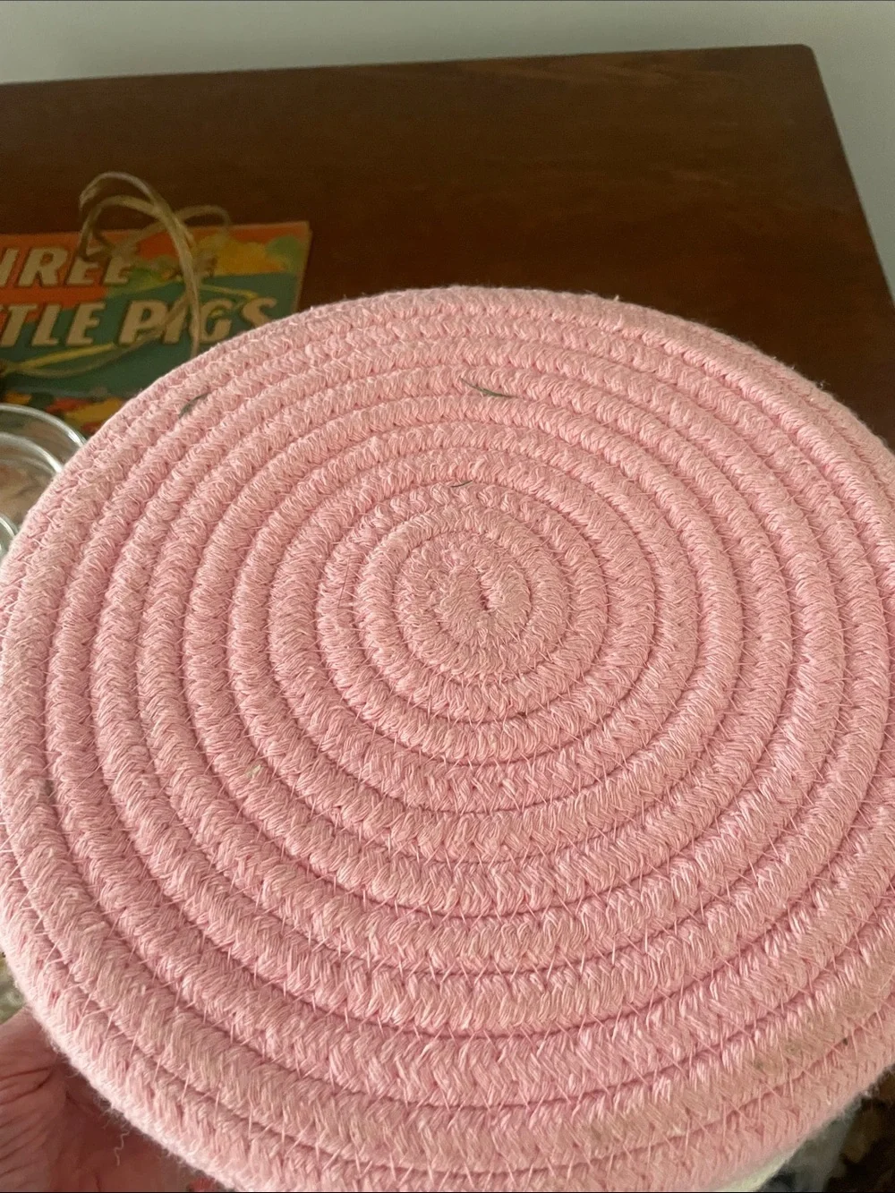Pink and white braided basket with handles